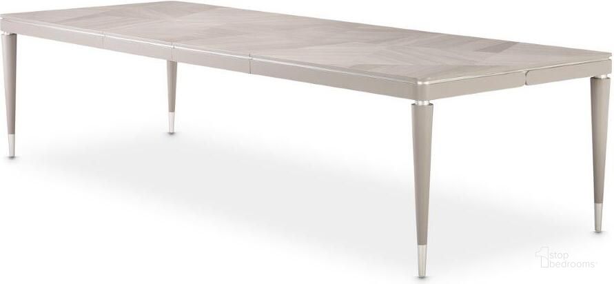 The appearance of Lanterna Rectangular Dining Table In Silver Mist designed by AICO in the modern / contemporary interior design. This silver piece of furniture  was selected by 1StopBedrooms from Lanterna Collection to add a touch of cosiness and style into your home. Sku: N9032000-823. Table Base Style: Legs. Material: Polyester. Product Type: Dining Table. Table Top Shape: Rectangular. Size: 124". Image1