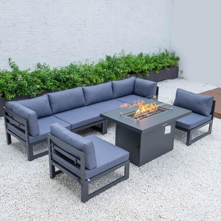 The appearance of Leisuremod Chelsea 7-Piece Patio Sectional And Fire Pit Table CSFBL-7BU designed by LeisureMod in the modern / contemporary interior design. This blue piece of furniture  was selected by 1StopBedrooms from Chelsea Collection to add a touch of cosiness and style into your home. Sku: CSFBL-7BU. Material: Aluminum. Product Type: Outdoor Sectional. Image1