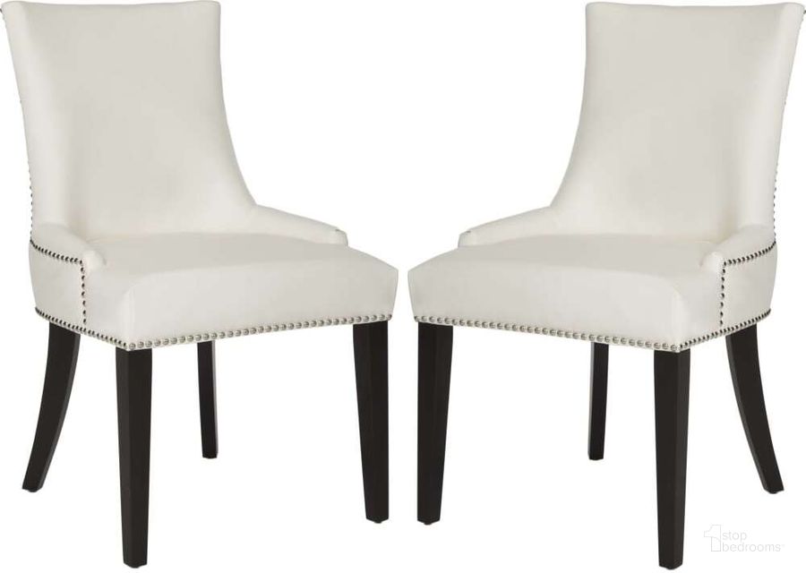 The appearance of Lester White Leather Dining Chair with Silver Nailhead Detail designed by Safavieh in the traditional interior design. This white leather piece of furniture  was selected by 1StopBedrooms from Lester Collection to add a touch of cosiness and style into your home. Sku: MCR4709N-SET2. Product Type: Dining Chair. Material: Stainless Steel. Image1