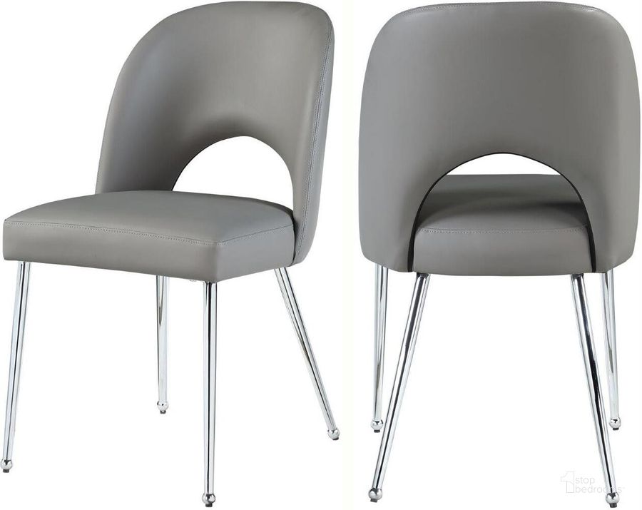 The appearance of Logan Grey Faux Leather Dining Chair Set Of 2 designed by Meridian in the modern / contemporary interior design. This grey faux leather piece of furniture  was selected by 1StopBedrooms from Logan Collection to add a touch of cosiness and style into your home. Sku: 999Grey-C. Product Type: Dining Chair. Material: Iron. Image1