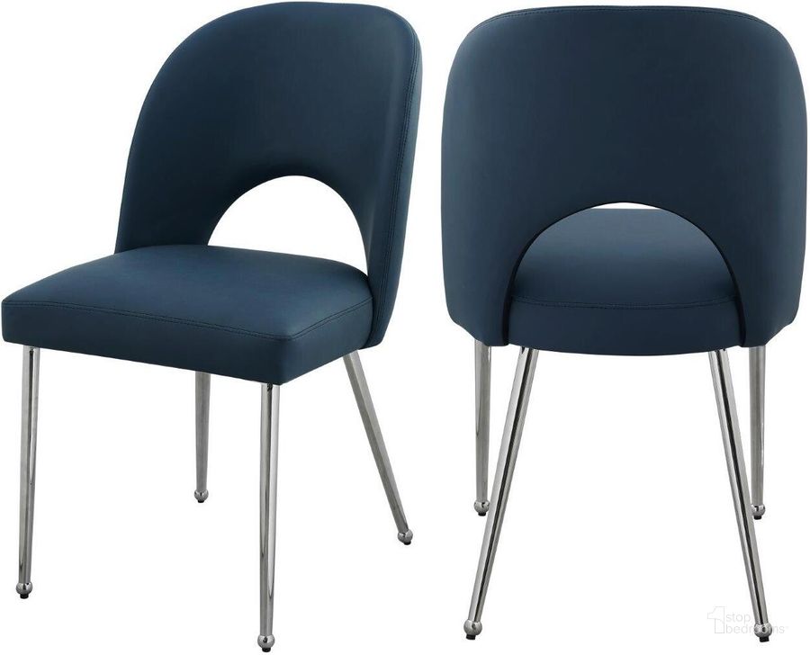 The appearance of Logan Navy Faux Leather Dining Chair Set Of 2 designed by Meridian in the modern / contemporary interior design. This navy piece of furniture  was selected by 1StopBedrooms from Logan Collection to add a touch of cosiness and style into your home. Sku: 999Navy-C. Product Type: Dining Chair. Material: Iron. Image1