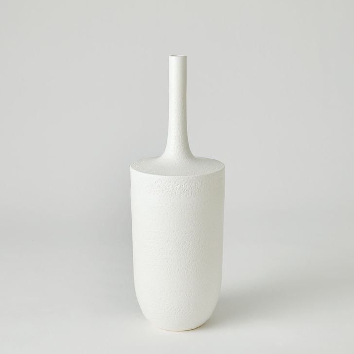The appearance of Lucca Small Vase In Matte White designed by Global Views in the modern / contemporary interior design. This white piece of furniture  was selected by 1StopBedrooms from Lucca Collection to add a touch of cosiness and style into your home. Sku: 7.30225. Material: Ceramic. Product Type: Vase. Image1