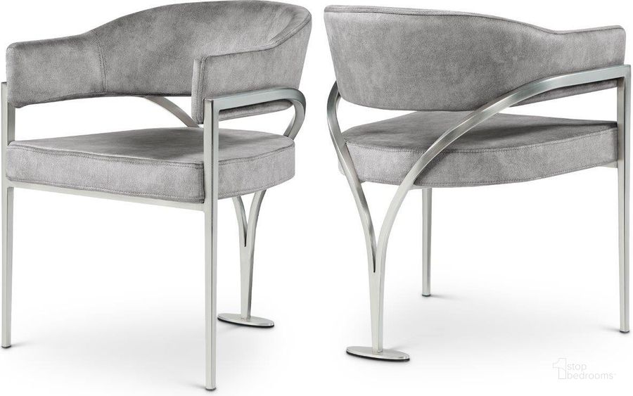 The appearance of Madelyn Grey Velvet Dining Chair Set of 2 designed by Meridian in the modern / contemporary interior design. This grey velvet piece of furniture  was selected by 1StopBedrooms from Madelyn Collection to add a touch of cosiness and style into your home. Sku: 554Grey-C. Product Type: Dining Chair. Material: Velvet. Image1