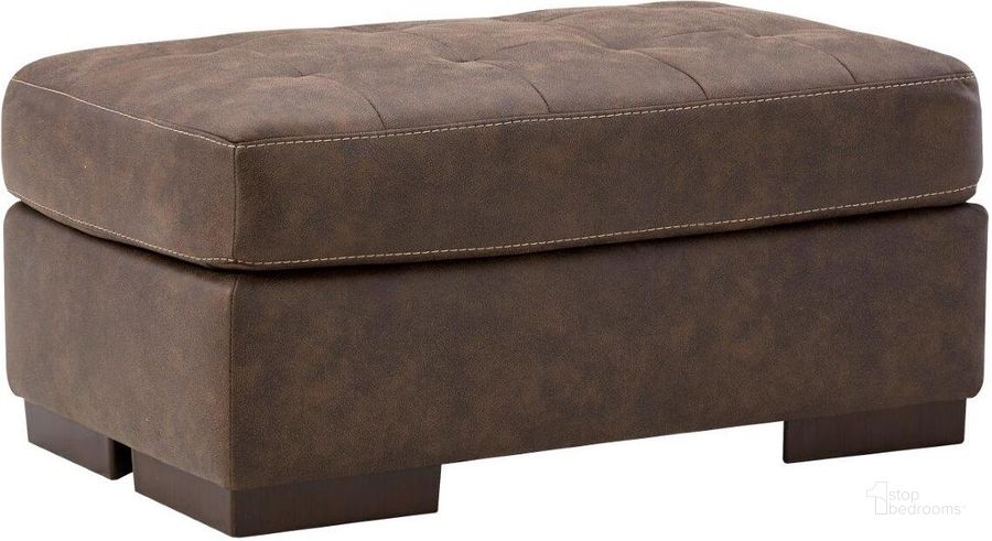 The appearance of Maderla Ottoman In Walnut designed by Signature Design by Ashley in the modern / contemporary interior design. This walnut piece of furniture  was selected by 1StopBedrooms from Maderla Collection to add a touch of cosiness and style into your home. Sku: 6200214. Material: Fabric. Product Type: Ottoman. Image1