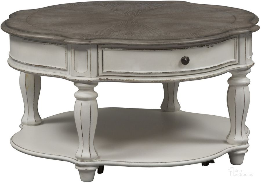 The appearance of Magnolia Manor Antique White Round Cocktail Table designed by Liberty in the transitional interior design. This antique white piece of furniture  was selected by 1StopBedrooms from Magnolia Manor Collection to add a touch of cosiness and style into your home. Sku: 244-OT1011. Table Top Shape: Round. Material: Wood. Product Type: Cocktail Table. Image1