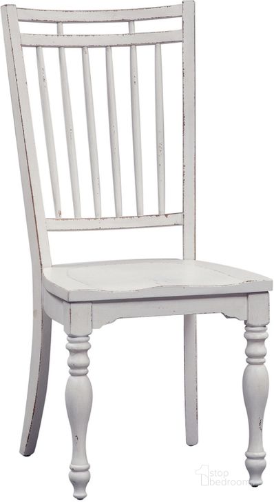 The appearance of Magnolia Manor Antique White Spindle Back Side Chair Set of 2 designed by Liberty in the country / farmhouse interior design. This antique white piece of furniture  was selected by 1StopBedrooms from Magnolia Manor Collection to add a touch of cosiness and style into your home. Sku: 244-C4000S. Product Type: Side Chair. Material: Rubberwood. Image1