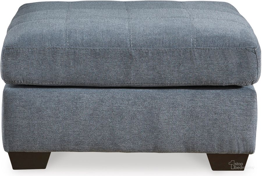 The appearance of Marelton Oversized Accent Ottoman In Denim designed by Signature Design by Ashley in the modern / contemporary interior design. This denim piece of furniture  was selected by 1StopBedrooms from Marleton Collection to add a touch of cosiness and style into your home. Sku: 5530308. Material: Fabric. Product Type: Ottoman. Image1
