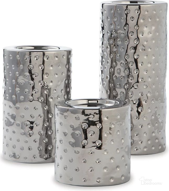 The appearance of Marisa Silver Finish Candle Holder Set of 3 designed by Signature Design by Ashley in the modern / contemporary interior design. This silver piece of furniture  was selected by 1StopBedrooms from Marisa Collection to add a touch of cosiness and style into your home. Sku: A2000460. Product Type: Candle Holder. Image1