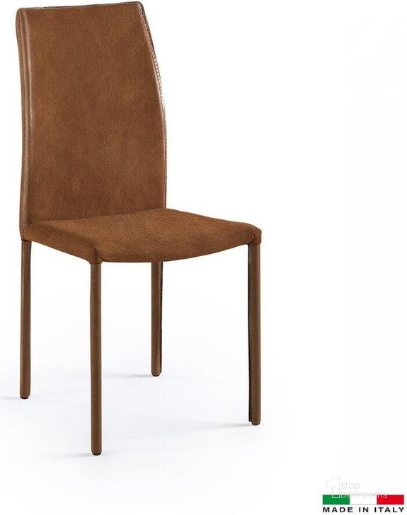 The appearance of Marta Dining Chair In Tan Set Of 2 designed by Bellini Modern Living in the modern / contemporary interior design. This tan piece of furniture  was selected by 1StopBedrooms from Marta Collection to add a touch of cosiness and style into your home. Sku: Marta TAN. Material: Leather. Product Type: Dining Chair. Image1