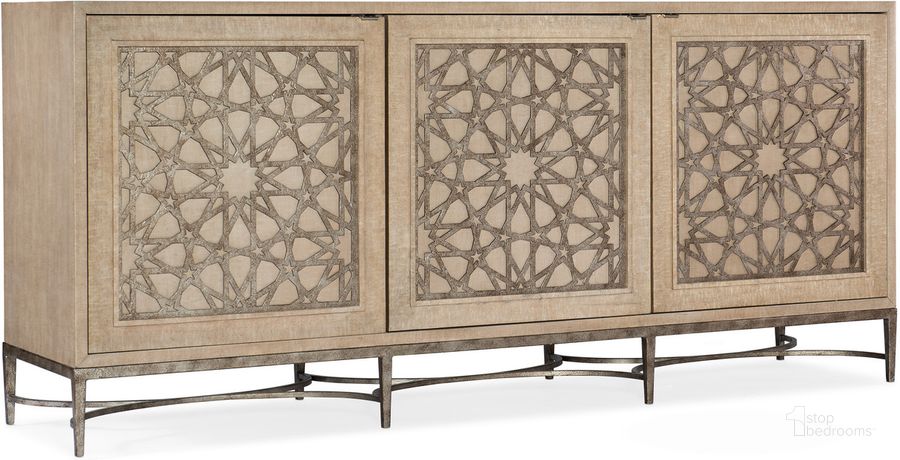 The appearance of Melange Suzani Three Door Entertainment Console In Beige designed by Hooker in the transitional interior design. This beige piece of furniture  was selected by 1StopBedrooms from Melange Collection to add a touch of cosiness and style into your home. Sku: 628-55013-80. Material: Wood. Product Type: Entertainment Console. Image1