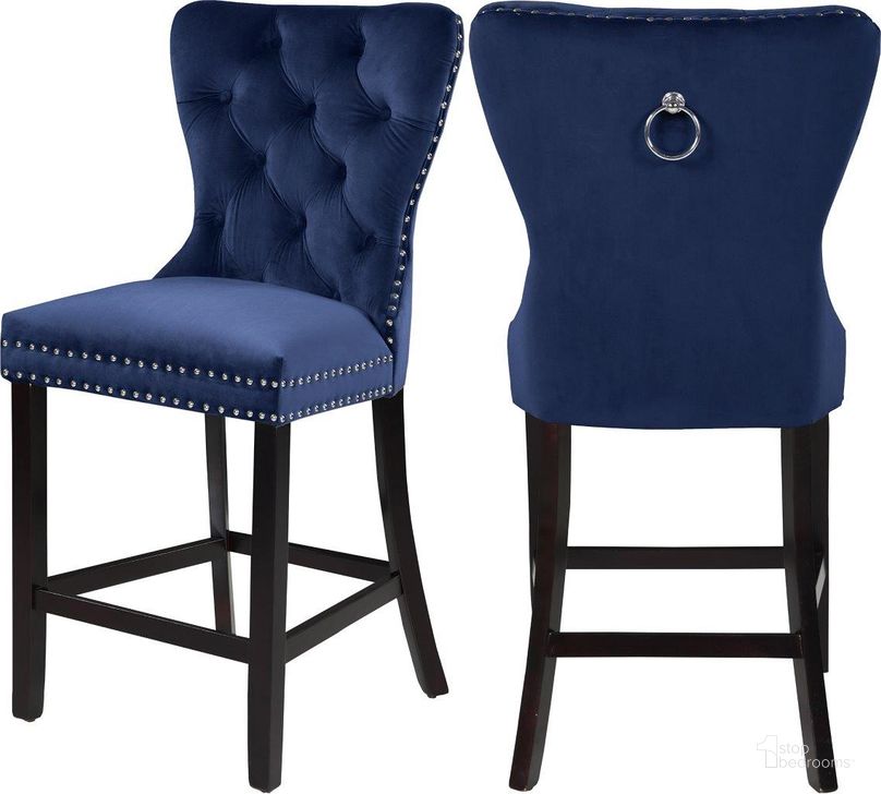 The appearance of Meridian 741NavyC Nikki Series Residential Fabric Upholstered Bar Stool Set of 2 designed by Meridian in the modern / contemporary interior design. This navy velvet piece of furniture  was selected by 1StopBedrooms from Nikki Collection to add a touch of cosiness and style into your home. Sku: 741Navy-C. Material: Wood. Product Type: Barstool. Image1