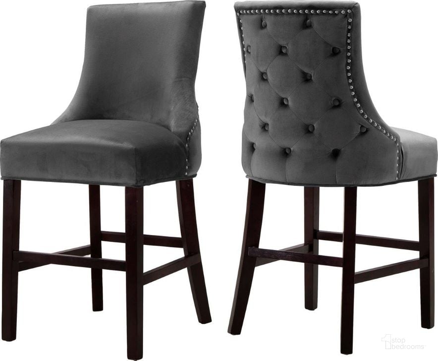 The appearance of Meridian 775GreyC Hannah Series Commercial Velvet Upholstered Bar Stool Set of 2 designed by Meridian in the modern / contemporary interior design. This grey velvet piece of furniture  was selected by 1StopBedrooms from Hannah Collection to add a touch of cosiness and style into your home. Sku: 775Grey-C. Material: Wood. Product Type: Barstool. Image1