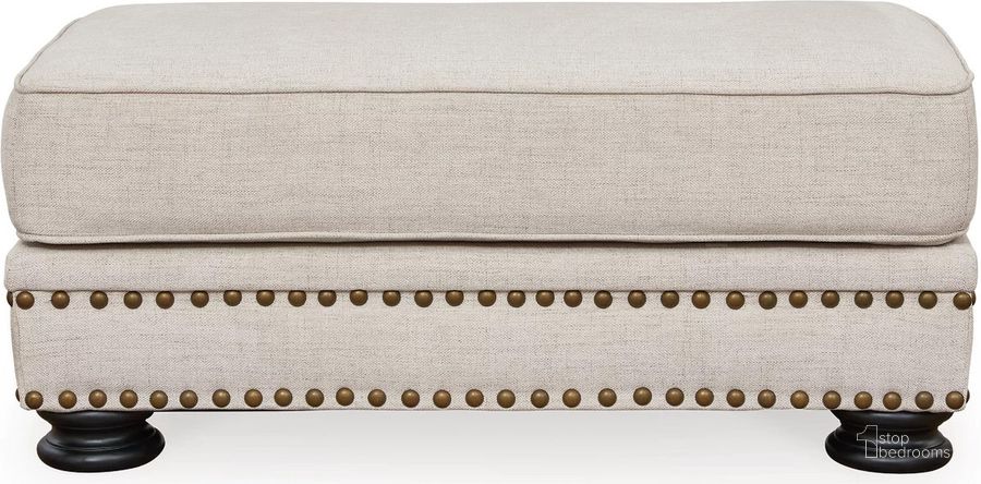 The appearance of Merrimore Ottoman In Linen designed by Signature Design by Ashley in the traditional interior design. This linen piece of furniture  was selected by 1StopBedrooms from Merrimore Collection to add a touch of cosiness and style into your home. Sku: 6550414. Material: Fabric. Product Type: Ottoman. Image1