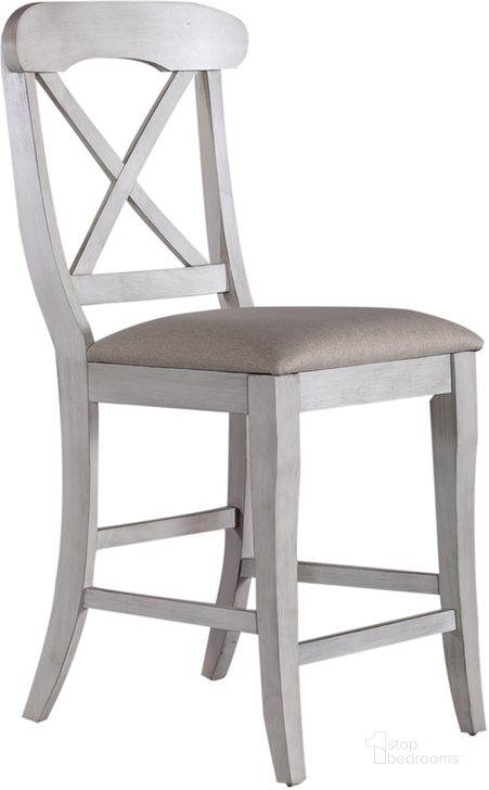 The appearance of Ocean Isle Upholstered Back Counter Chair Set Of 2 In White designed by Liberty in the traditional interior design. This white piece of furniture  was selected by 1StopBedrooms from Ocean Isle Collection to add a touch of cosiness and style into your home. Sku: 303W-B300124. Product Type: Counter Height Chair. Material: Rubberwood. Image1
