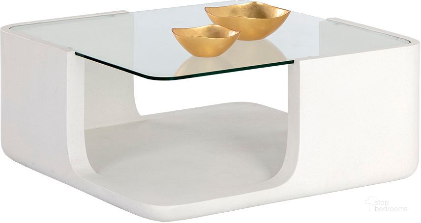 The appearance of Odis Coffee Table designed by Sunpan in the modern / contemporary interior design. This white piece of furniture  was selected by 1StopBedrooms from Odis Collection to add a touch of cosiness and style into your home. Sku: 106447. Material: Glass. Product Type: Coffee Table. Image1