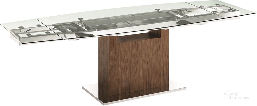 The appearance of Olivia Dining Table In Clear Glass With Walnut Veneer Base designed by Casabianca Home in the modern / contemporary interior design. This walnut piece of furniture  was selected by 1StopBedrooms from Olivia Collection to add a touch of cosiness and style into your home. Sku: TC-MAN03WALCLR. Table Base Style: Pedestal. Product Type: Dining Table. Table Top Shape: Rectangular. Material: Stainless Steel. Size: 71". Image1