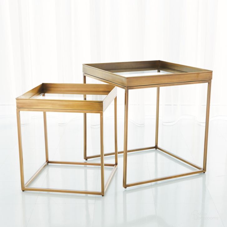 The appearance of Perfect Nesting Tables Set of 2 In Antique Brass designed by Global Views in the modern / contemporary interior design. This brass piece of furniture  was selected by 1StopBedrooms from Perfect Collection to add a touch of cosiness and style into your home. Sku: 7.90781. Material: Steel. Product Type: Nesting Table. Image1