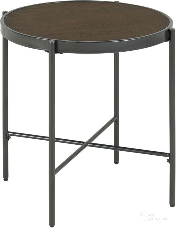 The appearance of Picket House Furnishings Carlo Round End Table With Wooden Top designed by Picket House in the transitional interior design. This black and brown piece of furniture  was selected by 1StopBedrooms from Carlo Collection to add a touch of cosiness and style into your home. Sku: CSO100ETWDE. Product Type: End Table. Material: MDF. Image1