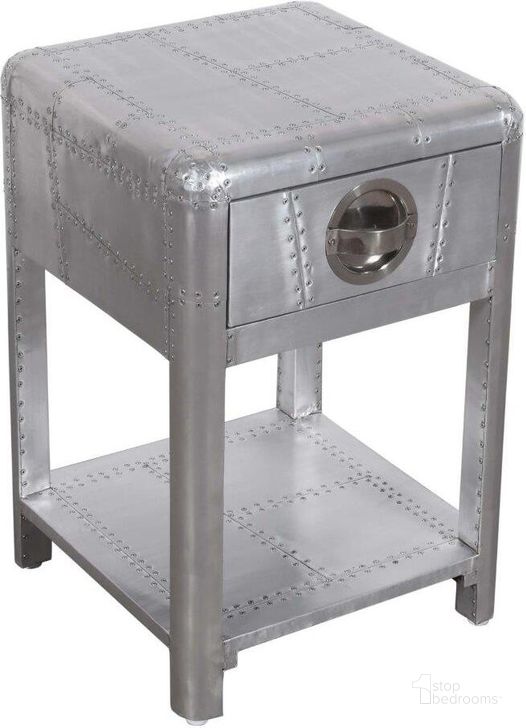 The appearance of Pilot 1 Drawer Side Table with Shelf In Silver designed by Moti in the modern / contemporary interior design. This silver piece of furniture  was selected by 1StopBedrooms from Pilot Collection to add a touch of cosiness and style into your home. Sku: 57014001. Material: Aluminum. Product Type: Side Table. Image1