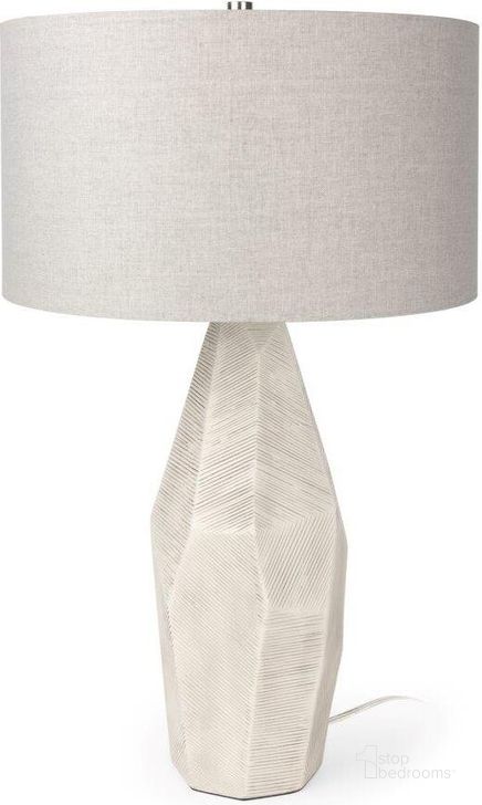 The appearance of Piven Cream Textured Ceramic Table Lamp designed by Mercana in the modern / contemporary interior design. This white piece of furniture  was selected by 1StopBedrooms from Piven Collection to add a touch of cosiness and style into your home. Sku: 70370. Material: Ceramic. Product Type: Table Lamp. Image1