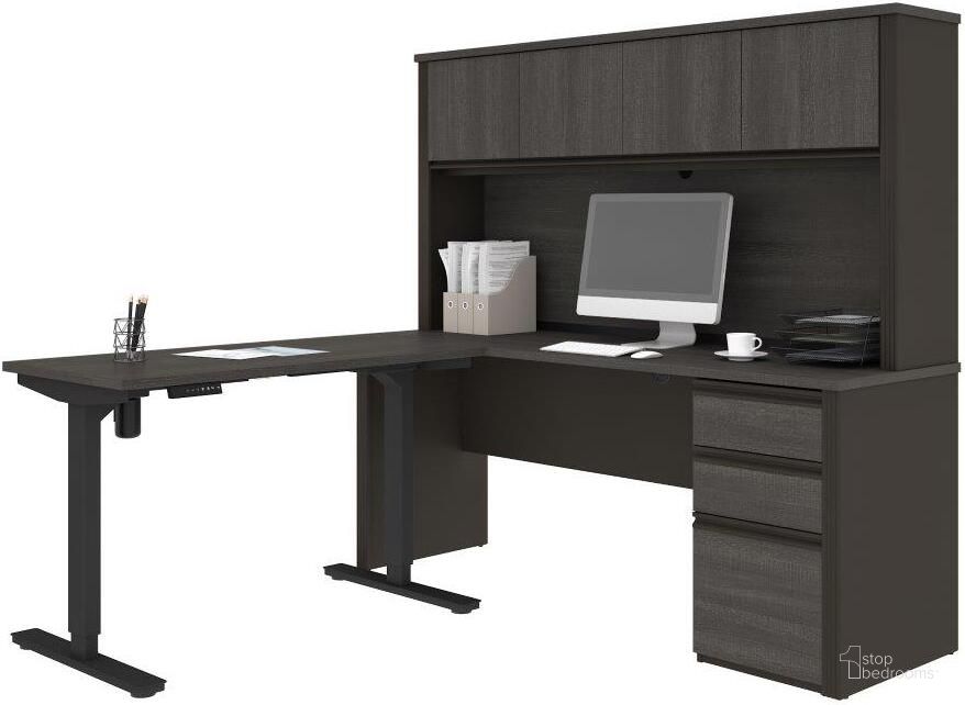 The appearance of Prestige + Height Adjustable L-Desk with Hutch in Bark Gray and Slate designed by Bestar in the modern / contemporary interior design. This slate piece of furniture  was selected by 1StopBedrooms from Prestige Plus Collection to add a touch of cosiness and style into your home. Sku: 99886-000047. Material: Wood. Product Type: Desk. Image1