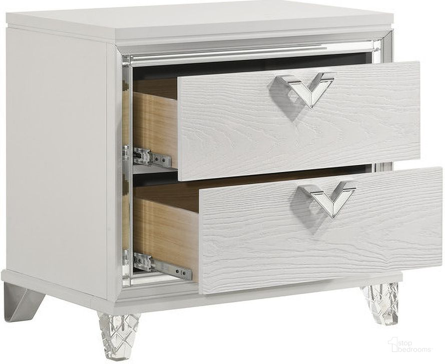 The appearance of Prism 2 Drawer Nightstand with LED Glow and V Shape Handles In White designed by Galaxy Home Furnishings in the modern / contemporary interior design. This white piece of furniture  was selected by 1StopBedrooms from Prism Collection to add a touch of cosiness and style into your home. Sku: 601955549288. Material: Wood. Product Type: Nightstand. Image1