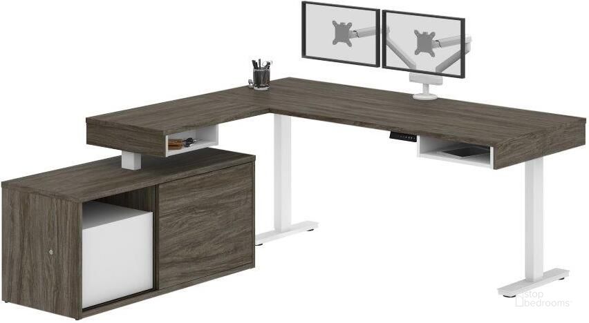 The appearance of Pro-Vega Height Adjustable L-Desk with Dual Monitor Arm in Walnut Grey and White designed by Bestar in the modern / contemporary interior design. This walnut gray piece of furniture  was selected by 1StopBedrooms from Pro-Vega Collection to add a touch of cosiness and style into your home. Sku: 130851-000035. Material: Wood. Product Type: Desk. Image1