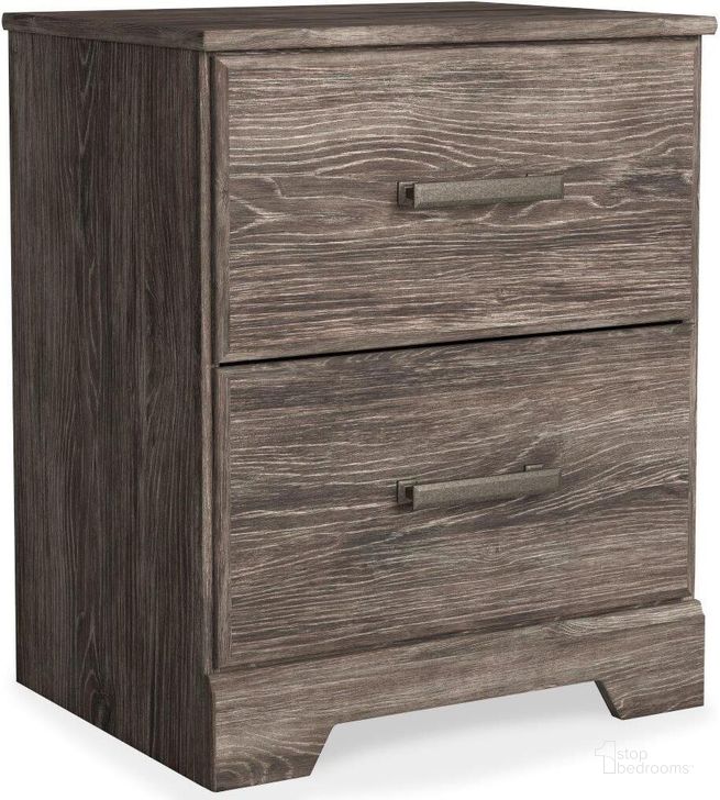 The appearance of Ralinksi Gray Two Drawer Night Stand designed by Signature Design by Ashley in the transitional interior design. This gray piece of furniture  was selected by 1StopBedrooms from Ralinksi Collection to add a touch of cosiness and style into your home. Sku: B2587-92. Material: Wood. Product Type: Nightstand. Image1