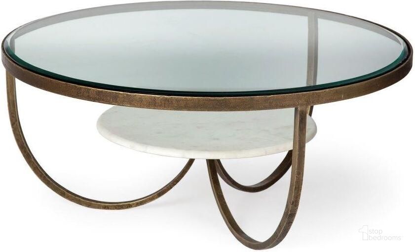 The appearance of Reinhardt 36 Inch Round Glass Top Marble Shelf Gold Metal Base Coffee Table designed by Mercana in the modern / contemporary interior design. This gold piece of furniture  was selected by 1StopBedrooms from Reinhardt Collection to add a touch of cosiness and style into your home. Sku: 67804. Material: Metal. Product Type: Coffee Table. Image1