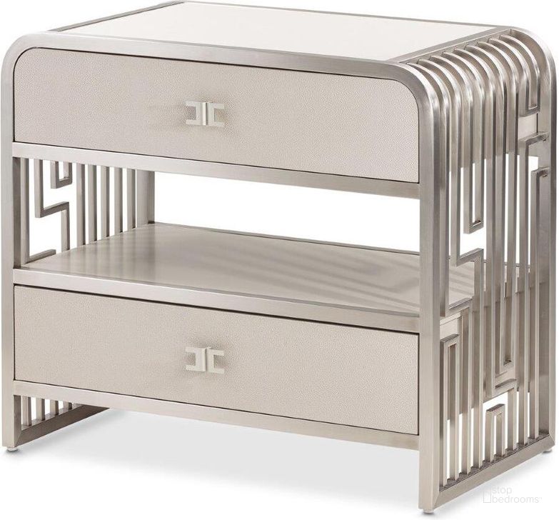 The appearance of Roxbury Park Metal Nightstand In Stainless Steel designed by AICO in the transitional interior design. This stainless steel piece of furniture  was selected by 1StopBedrooms from Roxburry Collection to add a touch of cosiness and style into your home. Sku: N9006042-13. Material: Marble. Product Type: Nightstand. Image1