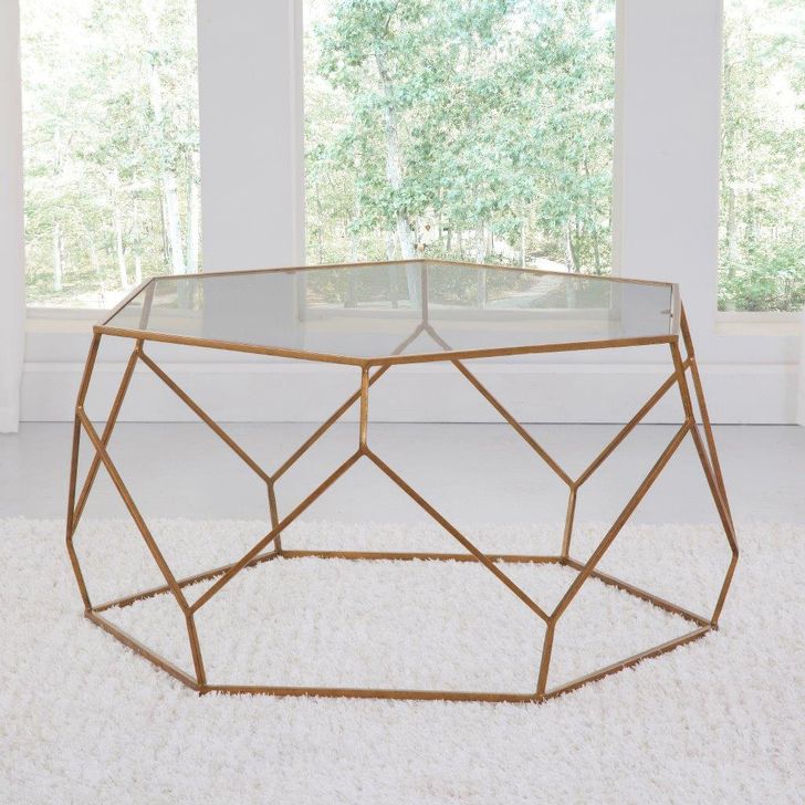 The appearance of Roxy Hexagonal Cocktail Table designed by Steve Silver in the transitional interior design. This gold piece of furniture  was selected by 1StopBedrooms from Roxy Collection to add a touch of cosiness and style into your home. Sku: RX100CT;RX100CB. Product Type: Cocktail Table. Material: Iron. Image1