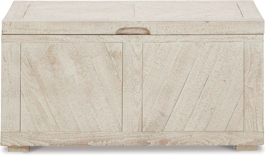 The appearance of Ryker Distressed White Storage Trunk designed by Signature Design by Ashley in the transitional interior design. This distressed white piece of furniture  was selected by 1StopBedrooms from Ryker Collection to add a touch of cosiness and style into your home. Sku: A4000306. Material: Wood. Product Type: Storage Trunk. Image1