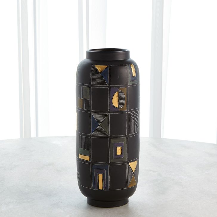 The appearance of Script Medium Vase In Black designed by Global Views in the modern / contemporary interior design. This black piece of furniture  was selected by 1StopBedrooms from Script Collection to add a touch of cosiness and style into your home. Sku: 3.3165. Material: Ceramic. Product Type: Vase. Image1