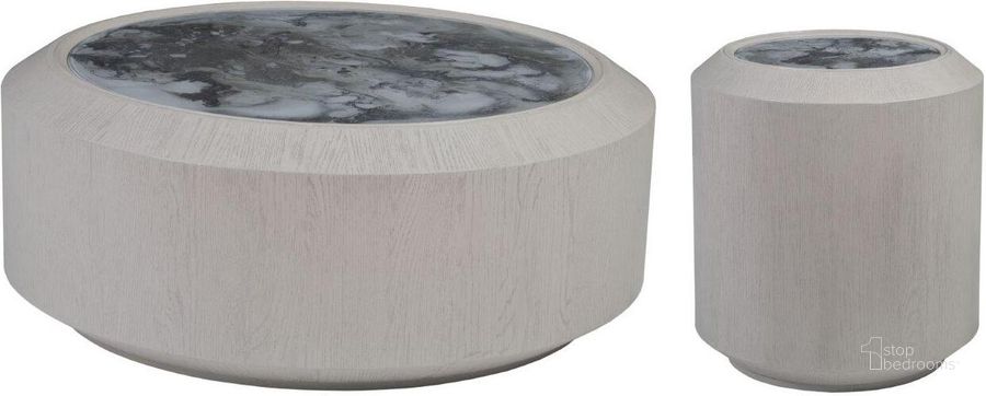 The appearance of Signature Designs White Sandblasted Metaphor Round Occasional Table Set designed by Artistica Home in the transitional interior design. This gray and white piece of furniture  was selected by 1StopBedrooms from Signature Designs Collection to add a touch of cosiness and style into your home. Sku: 01-2208-943C;01-2208-955C. Product Type: Occasional Table Set. Image1