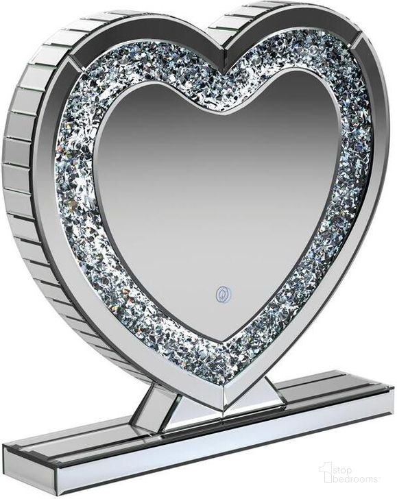 The appearance of Silver Heart-Shaped Table Mirror designed by Coaster in the modern / contemporary interior design. This silver piece of furniture  was selected by 1StopBedrooms from  to add a touch of cosiness and style into your home. Sku: 961528. Material: MDF. Product Type: Accent Mirror. Image1