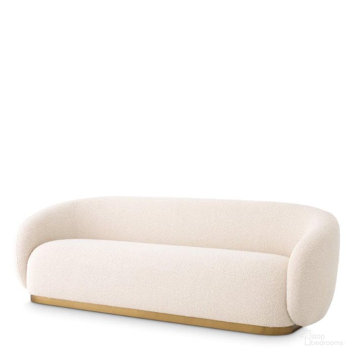 The appearance of Sofa Brice Boucle Cream designed by Eichholtz in the modern / contemporary interior design. This cream piece of furniture  was selected by 1StopBedrooms from Brice Collection to add a touch of cosiness and style into your home. Sku: A114864. Product Type: Sofa. Material: Brass. Image1