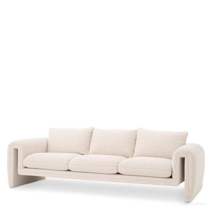 The appearance of Sofa Tondo Boucle Cream designed by Eichholtz in the modern / contemporary interior design. This cream piece of furniture  was selected by 1StopBedrooms from Tondo Collection to add a touch of cosiness and style into your home. Sku: A115461. Material: Fabric. Product Type: Sofa. Image1