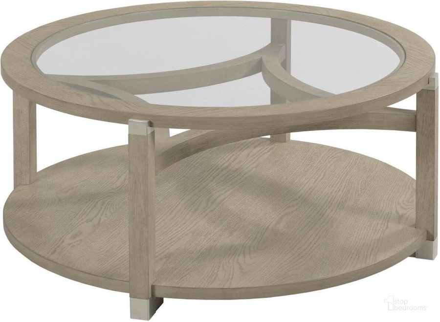 The appearance of Solstice Round Coffee Table designed by Hammary in the modern / contemporary interior design. This light stain piece of furniture  was selected by 1StopBedrooms from Solstice Collection to add a touch of cosiness and style into your home. Sku: 086-911. Material: Wood. Product Type: Coffee Table.