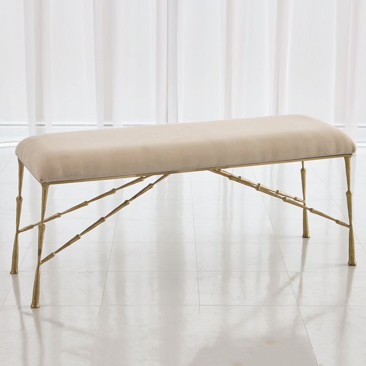 The appearance of Spike Large Bench With Muslin Cushion In Antique Brass designed by Global Views in the modern / contemporary interior design. This brass piece of furniture  was selected by 1StopBedrooms from Spike Collection to add a touch of cosiness and style into your home. Sku: 7.90881. Product Type: Bench. Material: Iron. Image1