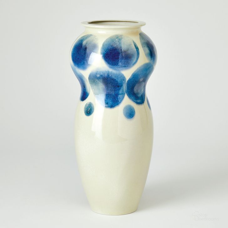 The appearance of Spots Vase In White With Blue Spots designed by Global Views in the modern / contemporary interior design. This blue piece of furniture  was selected by 1StopBedrooms from Spots Collection to add a touch of cosiness and style into your home. Sku: 7.10586. Material: Porcelain. Product Type: Vase. Image1