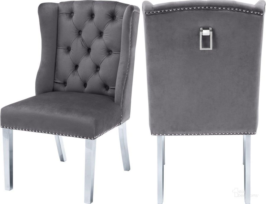 The appearance of Suri Grey Dining Chair Set of 2 designed by Meridian in the modern / contemporary interior design. This grey velvet piece of furniture  was selected by 1StopBedrooms from Suri Collection to add a touch of cosiness and style into your home. Sku: 809Grey-C. Product Type: Dining Chair. Material: Velvet. Image1