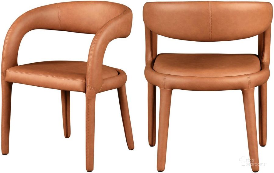 The appearance of Sylvester Cognac Faux Leather Dining Chair designed by Meridian in the modern / contemporary interior design. This cognac piece of furniture  was selected by 1StopBedrooms from Sylvester Collection to add a touch of cosiness and style into your home. Sku: 987Cognac-C. Material: Faux Leather. Product Type: Dining Chair. Image1
