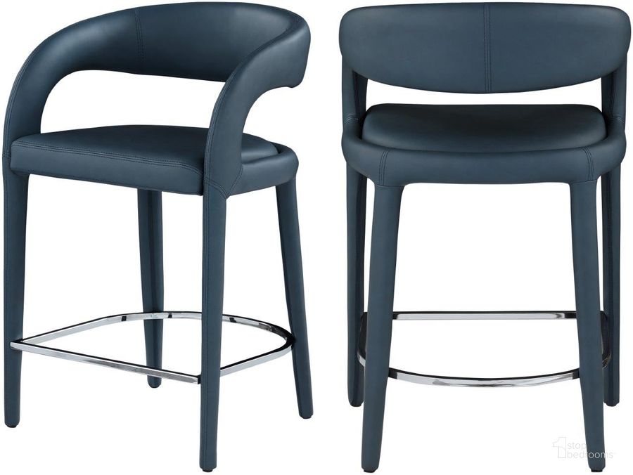 The appearance of Sylvester Navy Faux Leather Stool designed by Meridian in the modern / contemporary interior design. This navy piece of furniture  was selected by 1StopBedrooms from Sylvester Collection to add a touch of cosiness and style into your home. Sku: 989Navy-C. Material: Faux Leather. Product Type: Stool. Image1