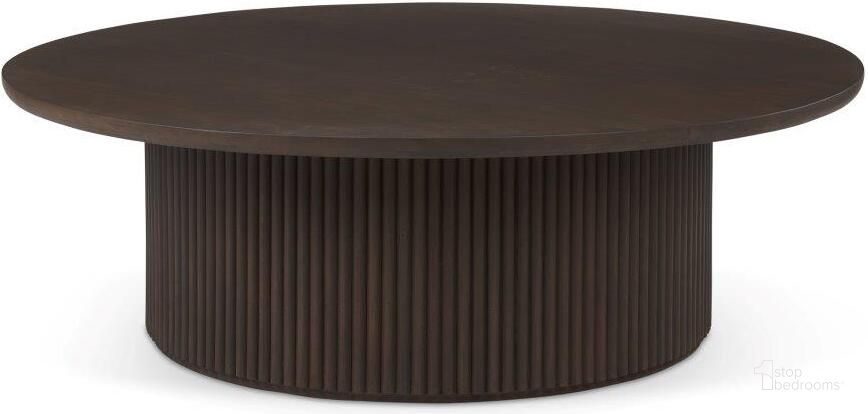 The appearance of Terra Dark Brown Wood Round Fluted Coffee Table designed by Mercana in the modern / contemporary interior design. This dark brown piece of furniture  was selected by 1StopBedrooms from Terra Collection to add a touch of cosiness and style into your home. Sku: 69877. Material: Wood. Product Type: Coffee Table. Image1