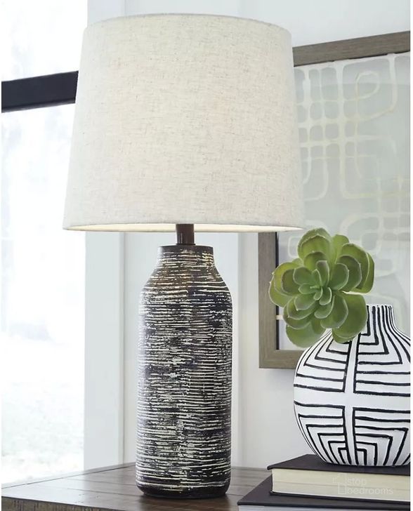 The appearance of Tollansford Black/White Lamp Set of 2 designed by Bennett Interiors in the transitional interior design. This black/white piece of furniture  was selected by 1StopBedrooms from Tollansford Collection to add a touch of cosiness and style into your home. Sku: L235584. Material: Other. Product Type: Table Lamp. Image1