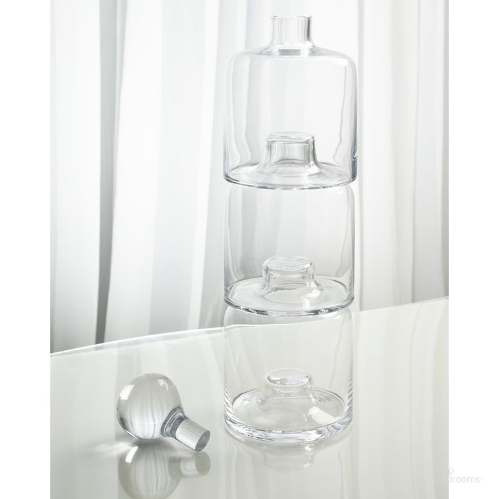 The appearance of Triple Stacking Decanter In Clear designed by Global Views in the traditional interior design. This clear piece of furniture  was selected by 1StopBedrooms from Triple Collection to add a touch of cosiness and style into your home. Sku: 7.60142. Material: Glass. Product Type: Decorative Accessory. Image1
