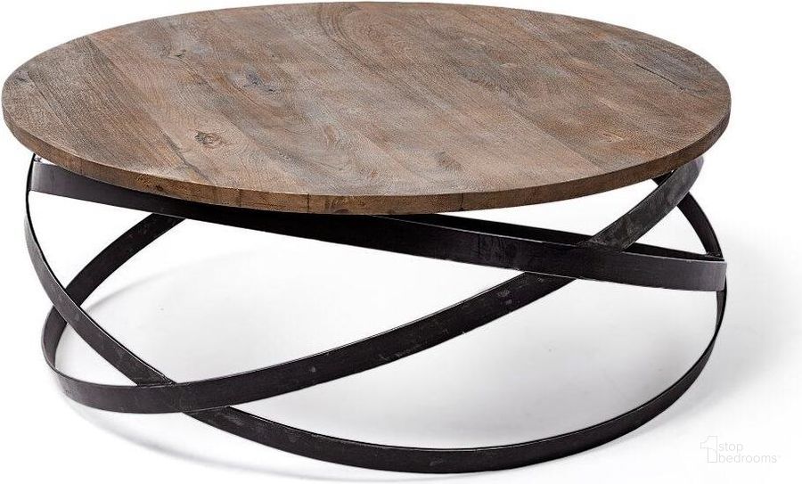The appearance of Triumph 40 Inch Round Brown Solid Wood Top Black Metal Base Coffee Table designed by Mercana in the modern / contemporary interior design. This black and brown piece of furniture  was selected by 1StopBedrooms from Triumph Collection to add a touch of cosiness and style into your home. Sku: 67108. Material: Wood. Product Type: Coffee Table. Image1