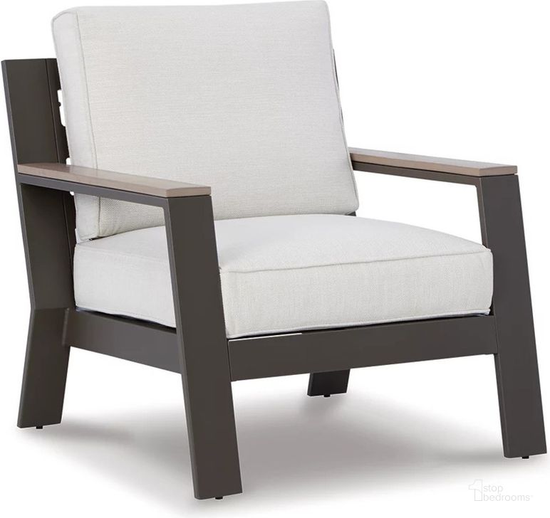 The appearance of Tropicava Taupe/White Lounge Chair W/Cushion designed by Signature Design by Ashley in the transitional interior design. This white and taupe piece of furniture  was selected by 1StopBedrooms from Tropicava Collection to add a touch of cosiness and style into your home. Sku: P514-820. Product Type: Outdoor Chair. Image1