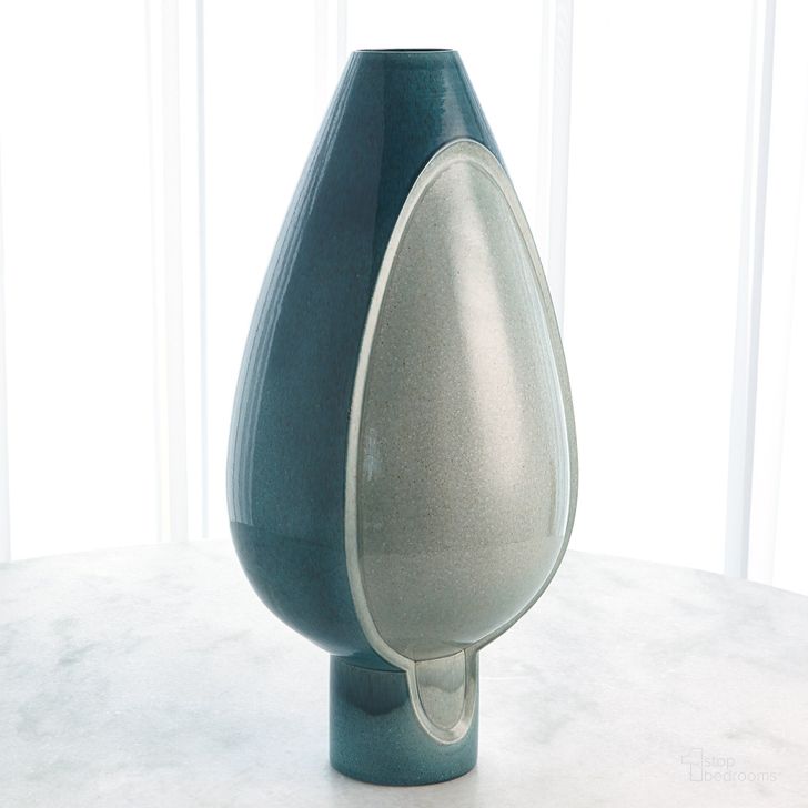 The appearance of Two Tone Pod Tall Vase In Azure designed by Global Views in the modern / contemporary interior design. This blue piece of furniture  was selected by 1StopBedrooms from Two Collection to add a touch of cosiness and style into your home. Sku: 1.10794. Material: Ceramic. Product Type: Vase. Image1