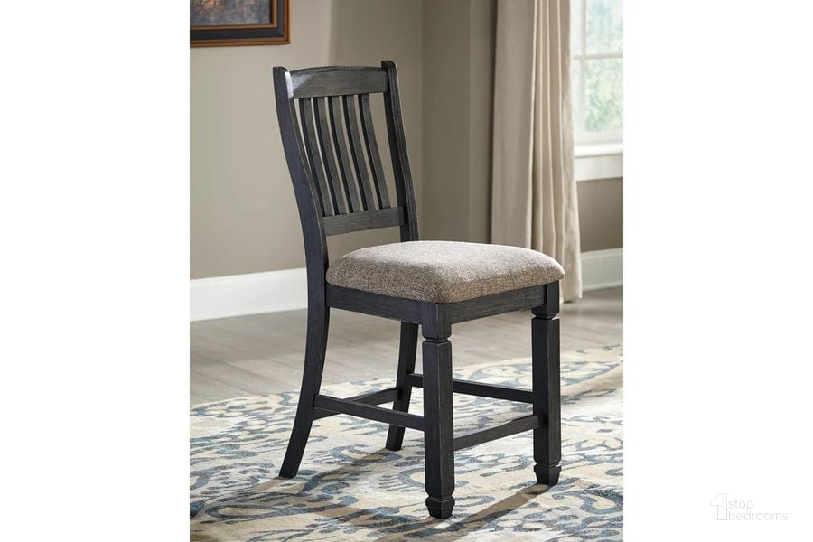 The appearance of Tyler Creek Black And Gray Upholstered Barstool Set of 2 designed by Signature Design by Ashley in the transitional interior design. This black/grayish brown piece of furniture  was selected by 1StopBedrooms from Tyler Creek Collection to add a touch of cosiness and style into your home. Sku: D736-124. Material: Fabric. Product Type: Barstool. Image1